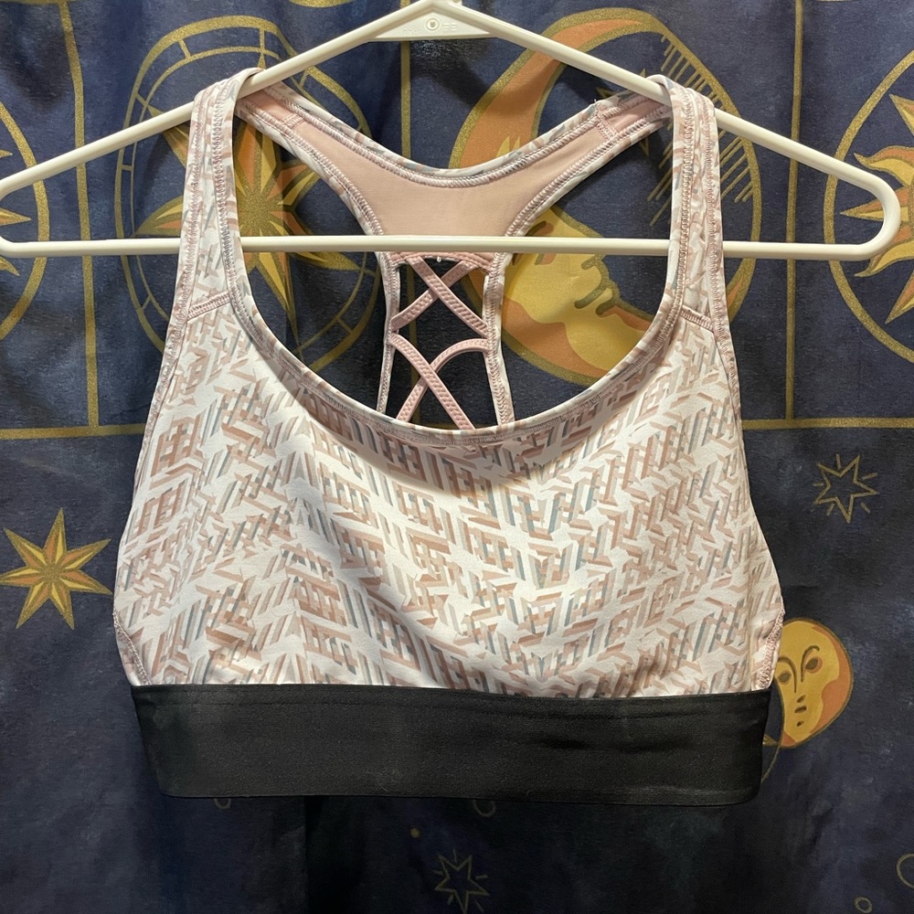 NWOT VS sports bra. Glows under black light